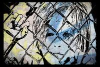 Youth behind the fence